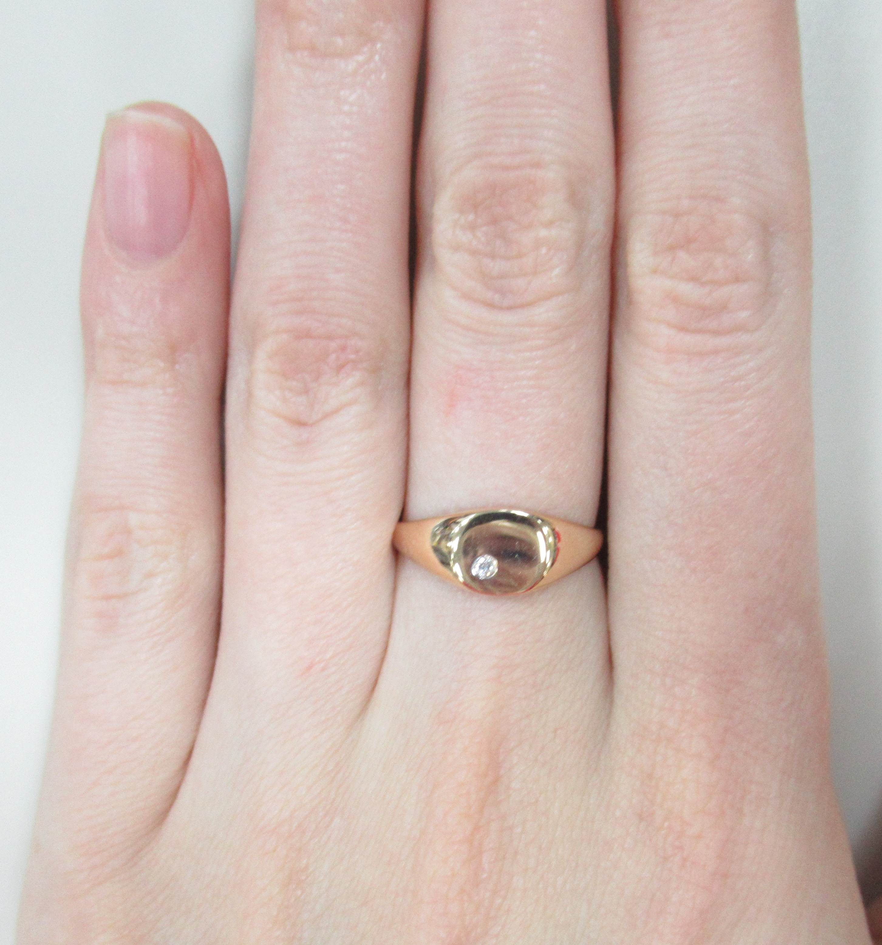 Золотое кольцо 585 пробы; родий; вставки 1 Бр.Кр-57 0,015 4/5А;